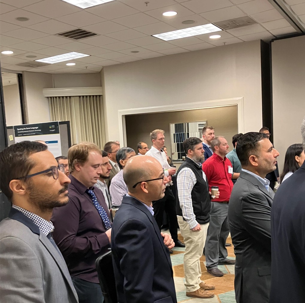 A view of attendees watching a presentation