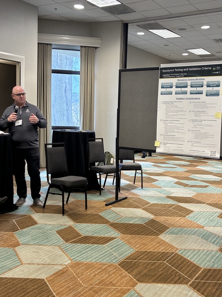 A speaker walking the conference through his poster presentation